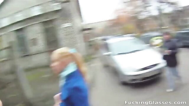 Amber Daikiri blonde in blue top and glasses outdoor parking lot