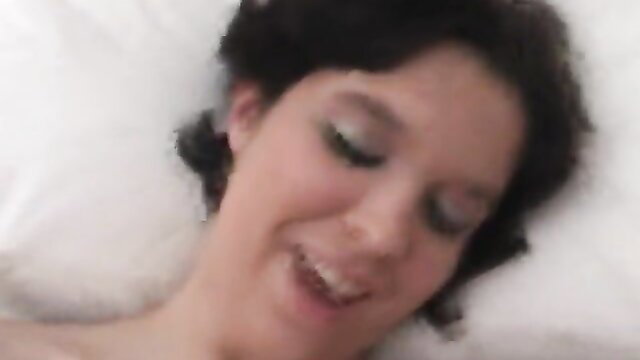 Alyssa Star smiling on bed in adult video thumbnail