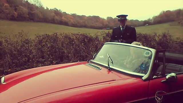 Hot blonde pulled over by stern cop in red convertible car
