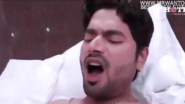 Indian man moaning in ecstasy on bed, intense adult scene