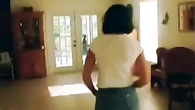 Older black wife turns and undresses in white tank top for hubby