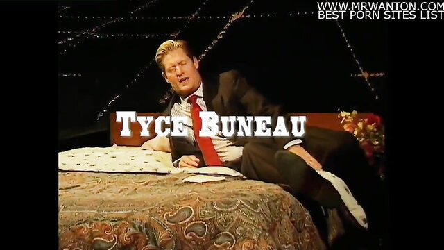 Tyce Buneau suited on bed, Homey In The Haystack gay scene