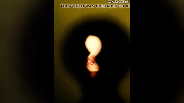 Milena in erotic glowing light bulb tease HD porn thumbnail