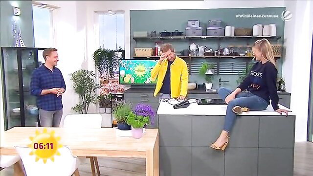 Alina Merkau in tight jeans foot tease on kitchen counter