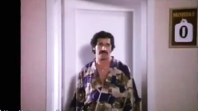 Sasha in Las Ficheras Mexican sex comedy, curly haired hunk in robe