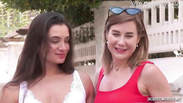 Claire and Elena in sexy tops smiling outdoors, hot lesbian tease