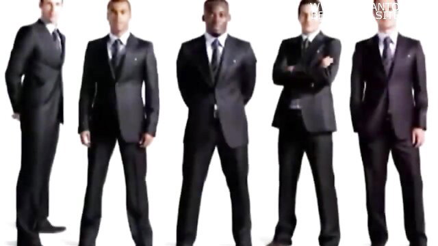 5 suited black suited men staring intently with Havana Bleu