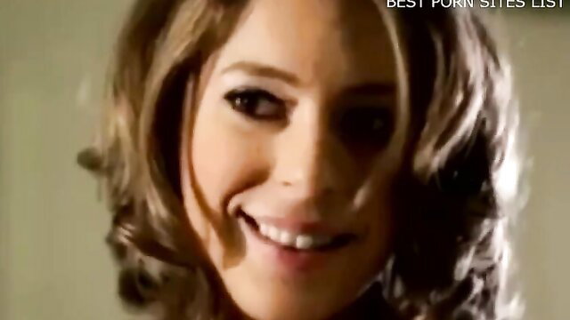 Blonde teacher smiling seductively at camera in sexy student scene