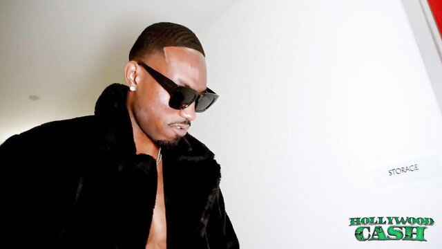 Black man in fur coat smirks for Kazumi Squirts Vs BBC thumbnail