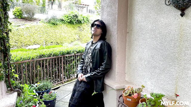 Elias Cash smoking in leather jacket and skirt on Mylf thumbnail