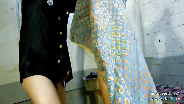 Sandra Milka in black dress lifting floral sheet, busty French babe