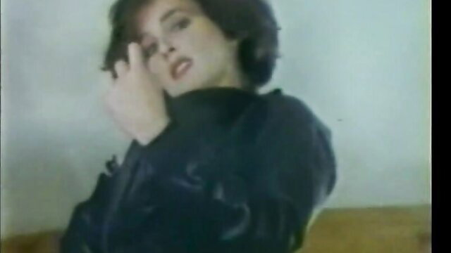 Laurie Smith seductive closeup in leather, sultry gaze
