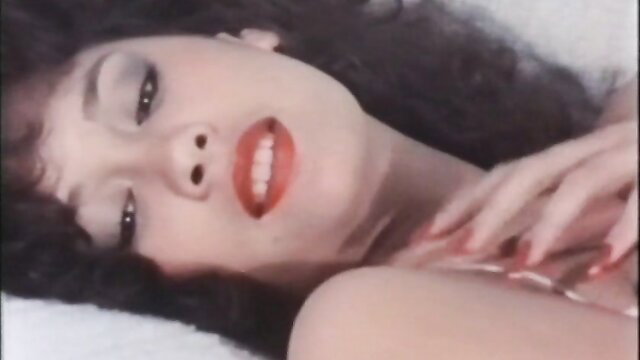Tina Marie smiling seductively with big saggy tits in hot milf sex scene