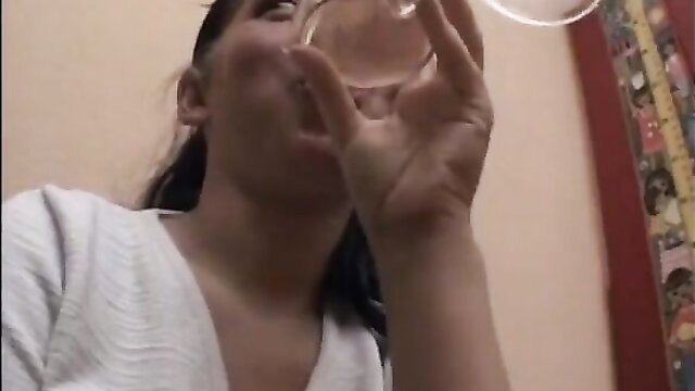 Unknown model drinking from a glass