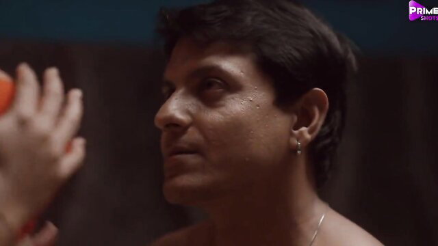 Malkin Bhabi man holds orange, intense gaze in PrimeShots web series