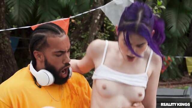 Purple-haired babe's natural tits exposed as black stud gropes her