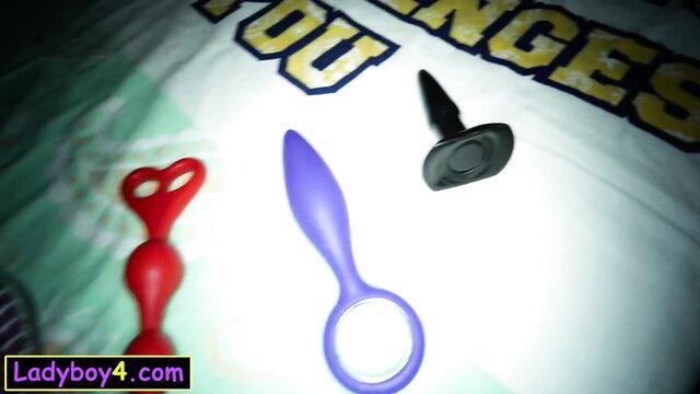 Red heart butt plugs, purple anal plug, black cock ring on LA4U t-shirt