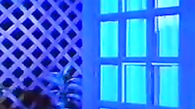 Kaitlyn Ashley in Sodomania 6 blue-lit window scene