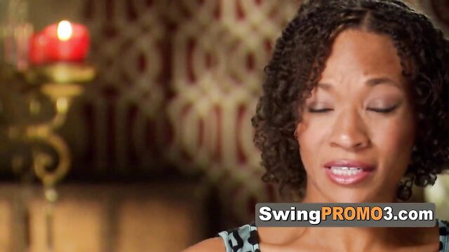 Curly-haired black woman eyes closed lips parted in swing house promo