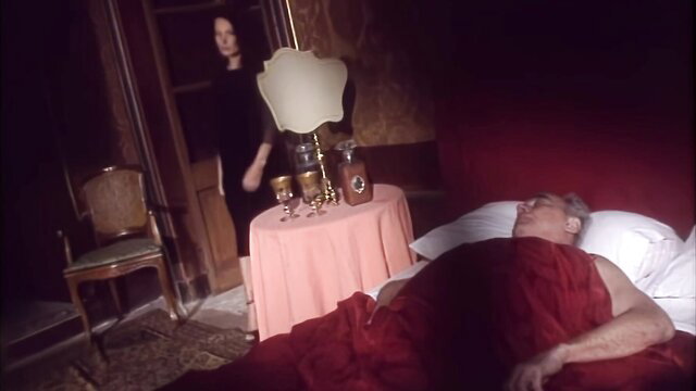 Mature man asleep in bed, dark-haired woman lurking in Mario Salieri's Contes Pervers
