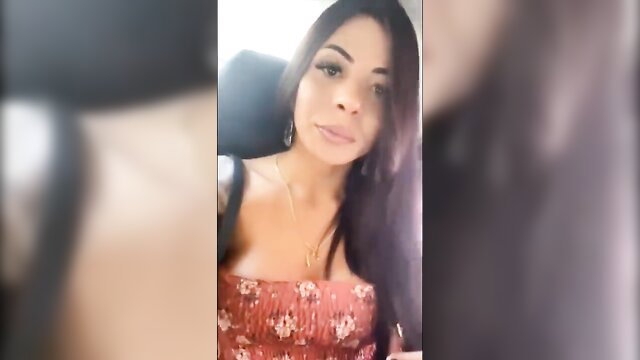 Latina t-girl in floral dress showing cleavage selfie