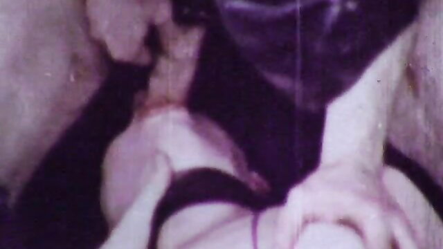 Vintage O.Z. Films porn: woman captured bound in dark fetish scene
