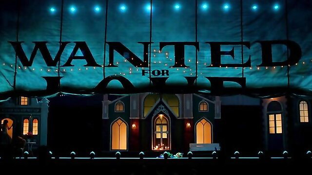 Wanted For Love theatrical stage with gothic houses and blue lights