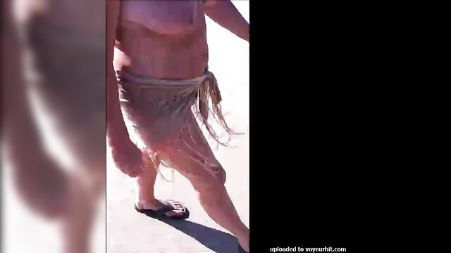 Mature wife walks topless in sheer skirt on Maspalomas dunes