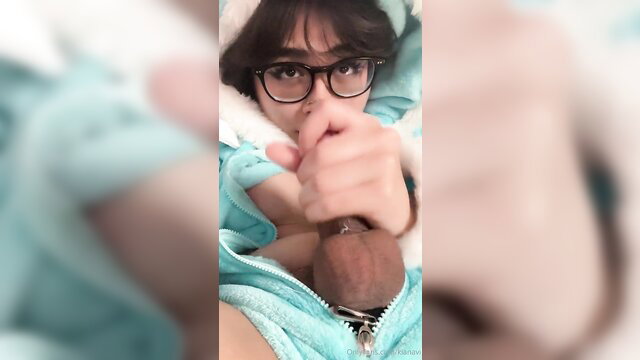 Kiyana Vi masturbates in bed, wearing glasses and a hoodie