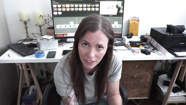 Yogabella in grey tee at desk, Mommy's Secret adult video thumbnail