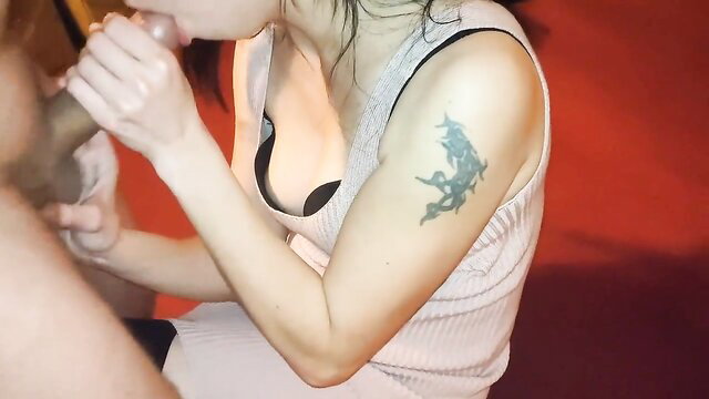Hot Asian babe with tattoos sucking cock passionately