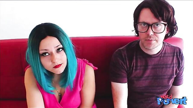 Busty Maeve Winters with teal hair deepthroats nerd cock on red couch
