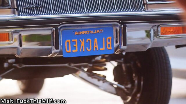 Violet Myers' lowrider car with California license plate closeup