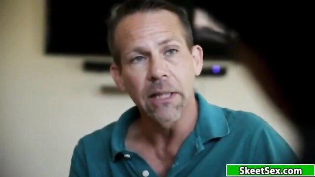 Middle-aged white man in green polo shirt speaking in interview