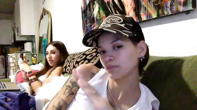 Angelia01m tattooed alt girl in hat on couch, wet pussy tease