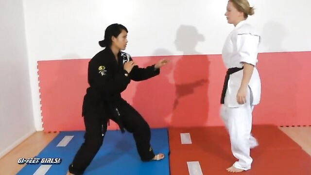 Japanese karate babe teaches blonde girl martial arts moves