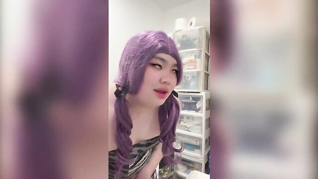 FNTwink in purple wig pigtails, seductive slutty cosplay pose
