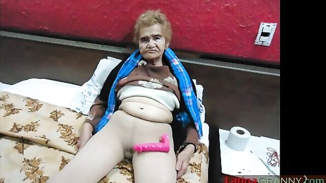 Latina granny spreads legs with pink dildo inserted in pussy