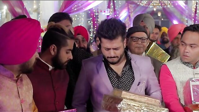 Punjabi men in turbans at wedding exchanging gifts, vibrant attire
