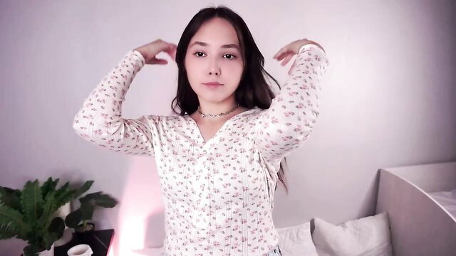 Tomifarrand shy 18yo Asian posing arms up in floral top