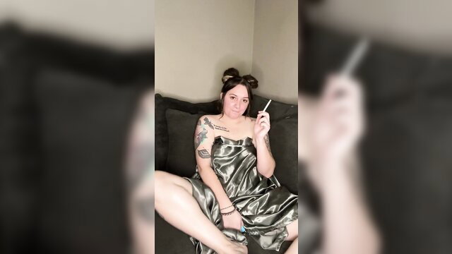 Tattooed alt girl in satin robe smokes cigarette solo tease