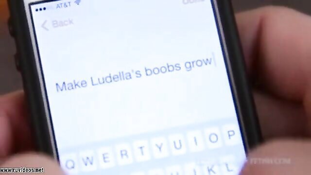 Ludella Hahn typing 'Make Ludella's boobs grow' on phone in Stepsister remote control