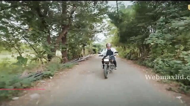 Indian man rides motorcycle on rural road in Ek Deewana Tha Ullu series