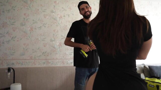 Mei Cornejo with Totalplay technician, teasing in tight black dress