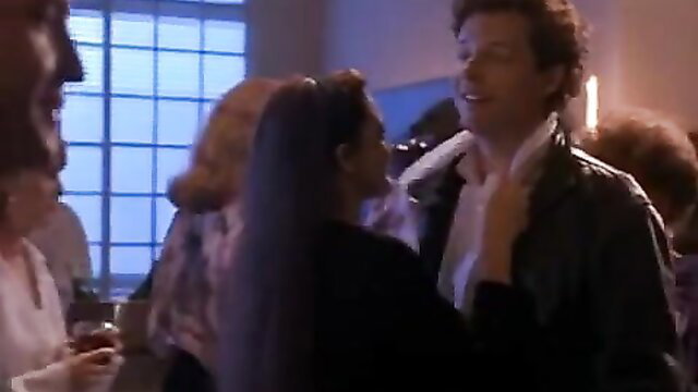 Drew Barrymore in leather jacket at party, flirty closeup
