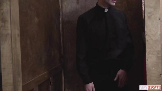 Hot priest in black clerical collar stands in dim room, Family Time 269