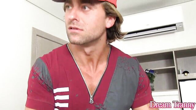 man in red shirt looking at something