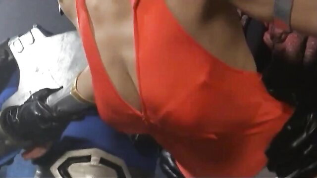 Busty Asian woman in red dress groped by gloved hands in cosplay