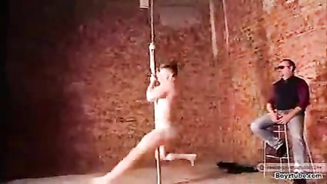 Nude young Russian pole dancer Denis gripped in steamy striptease