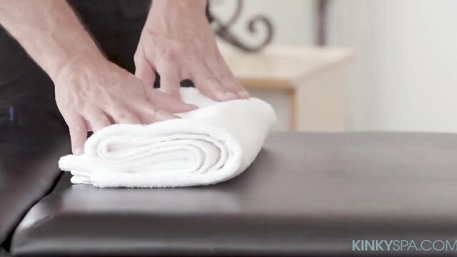 Gizelle Blanco folds towel before nude massage at Kinky Spa